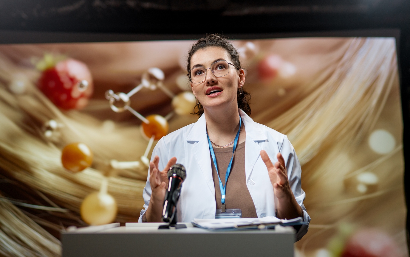 A life-sciences professional presenting at a conference